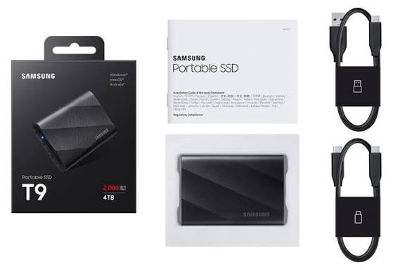 Samsung T9 Portable SSD — Black rubberized external SSD next to a PS5 controller
